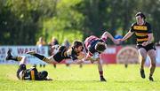 6 April 2025; Brian Johnston of Wicklow is tackled by Jonathan Crossley of County Carlow during the Bank of Ireland Provincial Towns Cup Semi-Final match between Wicklow RFC and County Carlow RFC at Silken Thomas Park in Kildare. Photo by Seb Daly/Sportsfile