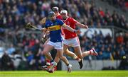 6 April 2025; Alan Tynan of Tipperary is dispossessed by Tim O'Mahony of Cork during the Allianz Hurling League Division 1A final match between Tipperary and Cork at SuperValu Páirc Uí Chaoimh in Cork. Photo by Brendan Moran/Sportsfile