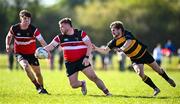 6 April 2025; Shane Farrar of Wicklow is tackled by Jonathan Crossley of County Carlow during the Bank of Ireland Provincial Towns Cup Semi-Final match between Wicklow RFC and County Carlow RFC at Silken Thomas Park in Kildare. Photo by Seb Daly/Sportsfile