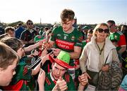 6 April 2025; Jack Carney of Mayo signs autographs for supporter after his side's victory in the Connacht GAA Football Senior Championship quarter-final match between Mayo and Sligo at Hastings Insurance MacHale Park in Castlebar, Mayo. Photo by Sam Barnes/Sportsfile