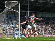 6 April 2025; Luke Towey of Sligo scores his side's first goal despite the efforts of Mayo goalkeeper Colm Reape and Matthew Ruane of Mayo during the Connacht GAA Football Senior Championship quarter-final match between Mayo and Sligo at Hastings Insurance MacHale Park in Castlebar, Mayo. Photo by Sam Barnes/Sportsfile