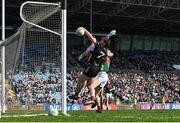 6 April 2025; Luke Towey of Sligo scores his side's first goal despite the efforts of Mayo goalkeeper Colm Reape and Matthew Ruane of Mayo during the Connacht GAA Football Senior Championship quarter-final match between Mayo and Sligo at Hastings Insurance MacHale Park in Castlebar, Mayo. Photo by Sam Barnes/Sportsfile
