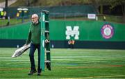6 April 2025; Iar Uachtarán Chumann Lúthchleas Gael Larry McCarthy helps prepare the pitch before the Connacht GAA Football Senior Championship quarter-final match between New York and Galway at Gaelic Park in New York, USA. Photo by Shauna Clinton/Sportsfile