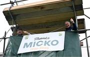 6 April 2025; Stewards hang up a poster in honour of late Kerry manager and footballer Mick O'Dwyer before the Connacht GAA Football Senior Championship quarter-final match between New York and Galway at Gaelic Park in New York, USA. Photo by Shauna Clinton/Sportsfile
