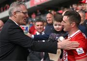 6 April 2025; Uachtarán Chumann Lúthchleas Gael Jarlath Burns congratulates Patrick Horgan of Cork, accompanied by his son Jack, after making a presentation marking Horgan being all-time leading scorer in the Allianz hurling league during the Allianz Hurling League Division 1A final match between Tipperary and Cork at SuperValu Páirc Uí Chaoimh in Cork. Photo by Brendan Moran/Sportsfile