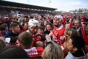 6 April 2025; Cork players Patrick Horgan, left, and Tim O'Mahony on the pitch with supporters after their side's victory in the Allianz Hurling League Division 1A final match between Tipperary and Cork at SuperValu Páirc Uí Chaoimh in Cork. Photo by Piaras Ó Mídheach/Sportsfile