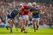 6 April 2025; Patrick Horgan of Cork kicks the sliotar away from Robert Doyle of Tipperary during the Allianz Hurling League Division 1A final match between Tipperary and Cork at SuperValu Páirc Uí Chaoimh in Cork. Photo by Brendan Moran/Sportsfile