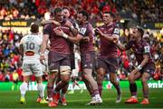 5 April 2025; Gavin Coombes of Munster celebrates with teammates, from left, Sean O'Brien, Andrew Smith, Tom Farrell and Craig Casey, after scoring their side's second try during the Investec Champions Cup Round of 16 match between La Rochelle and Munster at Stade Marcel Deflandre in La Rochelle, France. Photo by Ramsey Cardy/Sportsfile
