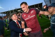 5 April 2025; Munster Rugby chief executive officer Ian Flanagan, left, congratulates Gavin Coombes of Munster after the Investec Champions Cup Round of 16 match between La Rochelle and Munster at Stade Marcel Deflandre in La Rochelle, France. Photo by Ramsey Cardy/Sportsfile