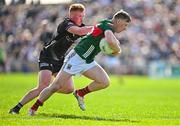 6 April 2025; Ryan O'Donoghue of Mayo in action against Evan Lyons of Sligo during the Connacht GAA Football Senior Championship quarter-final match between Mayo and Sligo at Hastings Insurance MacHale Park in Castlebar, Mayo. Photo by Sam Barnes/Sportsfile