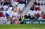 6 April 2025; Oisin Kelly of Offaly scores his side's second goal, under pressure from Gavin Fives of Waterford, during the Allianz Hurling League Division 1B final match between Waterford and Offaly at SuperValu Páirc Uí Chaoimh in Cork. Photo by Piaras Ó Mídheach/Sportsfile