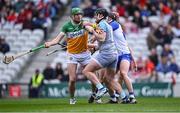 6 April 2025; Brian Duignan of Offaly in action against Waterford goalkeeper Billy Nolan during the Allianz Hurling League Division 1B final match between Waterford and Offaly at SuperValu Páirc Uí Chaoimh in Cork. Photo by Piaras Ó Mídheach/Sportsfile