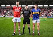 6 April 2025; Team captains Robert Downey of Cork and Ronan Maher of Tipperary with referee Seán Stack before the Allianz Hurling League Division 1A final match between Tipperary and Cork at SuperValu Páirc Uí Chaoimh in Cork. Photo by Piaras Ó Mídheach/Sportsfile