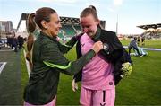 8 April 2025; Republic of Ireland goalkeeper Courtney Brosnan is assisted with her jacket by Grace Moloney before the UEFA Women's Nations League B match between Republic of Ireland and Greece at Tallaght Stadium in Dublin. Photo by Stephen McCarthy/Sportsfile