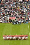 12 September 2004; The Cork team stand for the team photograph. Guinness All-Ireland Senior Hurling Championship Final, Cork v Kilkenny, Croke Park, Dublin. Picture credit; Pat Murphy / SPORTSFILE *** Local Caption *** Any photograph taken by SPORTSFILE during, or in connection with, the 2004 Guinness All-Ireland Hurling Final which displays GAA logos or contains an image or part of an image of any GAA intellectual property, or, which contains images of a GAA player/players in their playing uniforms, may only be used for editorial and non-advertising purposes.  Use of photographs for advertising, as posters or for purchase separately is strictly prohibited unless prior written approval has been obtained from the Gaelic Athletic Association.