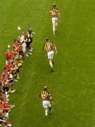 12 September 2004; The Kilkenny players make their way onto the pitch. Guinness All-Ireland Senior Hurling Championship Final, Cork v Kilkenny, Croke Park, Dublin. Picture credit; Pat Murphy / SPORTSFILE *** Local Caption *** Any photograph taken by SPORTSFILE during, or in connection with, the 2004 Guinness All-Ireland Hurling Final which displays GAA logos or contains an image or part of an image of any GAA intellectual property, or, which contains images of a GAA player/players in their playing uniforms, may only be used for editorial and non-advertising purposes.  Use of photographs for advertising, as posters or for purchase separately is strictly prohibited unless prior written approval has been obtained from the Gaelic Athletic Association.