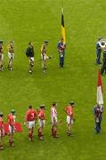 12 September 2004; The Cork and Kilkenny players prepare for the pre-match parade. Guinness All-Ireland Senior Hurling Championship Final, Cork v Kilkenny, Croke Park, Dublin. Picture credit; Pat Murphy / SPORTSFILE *** Local Caption *** Any photograph taken by SPORTSFILE during, or in connection with, the 2004 Guinness All-Ireland Hurling Final which displays GAA logos or contains an image or part of an image of any GAA intellectual property, or, which contains images of a GAA player/players in their playing uniforms, may only be used for editorial and non-advertising purposes.  Use of photographs for advertising, as posters or for purchase separately is strictly prohibited unless prior written approval has been obtained from the Gaelic Athletic Association.