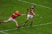 12 September 2004; J.J. Delaney, Kilkenny, in action against Joe Deane, Cork. Guinness All-Ireland Senior Hurling Championship Final, Cork v Kilkenny, Croke Park, Dublin. Picture credit; Pat Murphy / SPORTSFILE *** Local Caption *** Any photograph taken by SPORTSFILE during, or in connection with, the 2004 Guinness All-Ireland Hurling Final which displays GAA logos or contains an image or part of an image of any GAA intellectual property, or, which contains images of a GAA player/players in their playing uniforms, may only be used for editorial and non-advertising purposes.  Use of photographs for advertising, as posters or for purchase separately is strictly prohibited unless prior written approval has been obtained from the Gaelic Athletic Association.