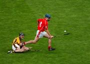 12 September 2004; Tom Kenny, Cork, goes past the challenge of Tommy Walsh, Kilkenny. Guinness All-Ireland Senior Hurling Championship Final, Cork v Kilkenny, Croke Park, Dublin. Picture credit; Pat Murphy / SPORTSFILE *** Local Caption *** Any photograph taken by SPORTSFILE during, or in connection with, the 2004 Guinness All-Ireland Hurling Final which displays GAA logos or contains an image or part of an image of any GAA intellectual property, or, which contains images of a GAA player/players in their playing uniforms, may only be used for editorial and non-advertising purposes.  Use of photographs for advertising, as posters or for purchase separately is strictly prohibited unless prior written approval has been obtained from the Gaelic Athletic Association.