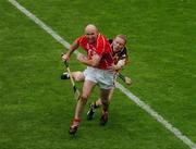 12 September 2004; Brian Corcoran, Cork, in action against James Ryall, Kilkenny. Guinness All-Ireland Senior Hurling Championship Final, Cork v Kilkenny, Croke Park, Dublin. Picture credit; Pat Murphy / SPORTSFILE *** Local Caption *** Any photograph taken by SPORTSFILE during, or in connection with, the 2004 Guinness All-Ireland Hurling Final which displays GAA logos or contains an image or part of an image of any GAA intellectual property, or, which contains images of a GAA player/players in their playing uniforms, may only be used for editorial and non-advertising purposes.  Use of photographs for advertising, as posters or for purchase separately is strictly prohibited unless prior written approval has been obtained from the Gaelic Athletic Association.
