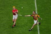 12 September 2004; Joe Deane, Cork, in action against Michael Kavanagh, Kilkenny. Guinness All-Ireland Senior Hurling Championship Final, Cork v Kilkenny, Croke Park, Dublin. Picture credit; Pat Murphy / SPORTSFILE *** Local Caption *** Any photograph taken by SPORTSFILE during, or in connection with, the 2004 Guinness All-Ireland Hurling Final which displays GAA logos or contains an image or part of an image of any GAA intellectual property, or, which contains images of a GAA player/players in their playing uniforms, may only be used for editorial and non-advertising purposes.  Use of photographs for advertising, as posters or for purchase separately is strictly prohibited unless prior written approval has been obtained from the Gaelic Athletic Association.