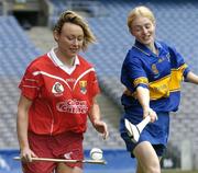 14 September 2004; Camogie senior captains, Stephanie Dunlea, Cork, left, with Joanne Ryan, Tipperary, at a photocall in Croke Park before Sunday's All Ireland Camogie Junior and Senior Finals in Croke Park. Dublin. Picture credit; David Maher / SPORTSFILE