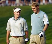 14 September 2004; Padraig Harrington and Luke Donald, Team Europe 2004, make their way down the first fairway in advance of the 35th Ryder Cup Matches. Oakland Hills Country Club, Bloomfield Township, Michigan, USA. Picture credit; Matt Browne / SPORTSFILE
