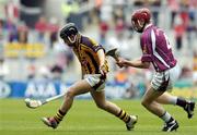 12 September 2004; Richie Hogan, Kilkenny, in action against Ciaran O'Donovan, Galway. All-Ireland Minor Hurling Championship Final, Galway v Kilkenny, Croke Park, Dublin. Picture credit; Damien Eagers / SPORTSFILE *** Local Caption *** Any photograph taken by SPORTSFILE during, or in connection with, the 2004 Guinness All-Ireland Hurling Final which displays GAA logos or contains an image or part of an image of any GAA intellectual property, or, which contains images of a GAA player/players in their playing uniforms, may only be used for editorial and non-advertising purposes.  Use of photographs for advertising, as posters or for purchase separately is strictly prohibited unless prior written approval has been obtained from the Gaelic Athletic Association.