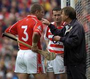 12 September 2004; Cork manager Donal O'Grady issues instructions to Cork goalkeeper Donal Og Cusack and team-mate Diarmuid O'Sullivan. Guinness All-Ireland Senior Hurling Championship Final, Cork v Kilkenny, Croke Park, Dublin. Picture credit; Damien Eagers / SPORTSFILE *** Local Caption *** Any photograph taken by SPORTSFILE during, or in connection with, the 2004 Guinness All-Ireland Hurling Final which displays GAA logos or contains an image or part of an image of any GAA intellectual property, or, which contains images of a GAA player/players in their playing uniforms, may only be used for editorial and non-advertising purposes.  Use of photographs for advertising, as posters or for purchase separately is strictly prohibited unless prior written approval has been obtained from the Gaelic Athletic Association.