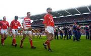 12 September 2004; Cork captain Ben O'Connor leads his team during the pre match parade. Guinness All-Ireland Senior Hurling Championship Final, Cork v Kilkenny, Croke Park, Dublin. Picture credit; Damien Eagers / SPORTSFILE *** Local Caption *** Any photograph taken by SPORTSFILE during, or in connection with, the 2004 Guinness All-Ireland Hurling Final which displays GAA logos or contains an image or part of an image of any GAA intellectual property, or, which contains images of a GAA player/players in their playing uniforms, may only be used for editorial and non-advertising purposes.  Use of photographs for advertising, as posters or for purchase separately is strictly prohibited unless prior written approval has been obtained from the Gaelic Athletic Association.