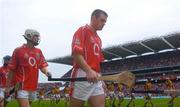 12 September 2004; Cork players Niall McCarthy and Timmy McCarthy, left, during the pre match parade. Guinness All-Ireland Senior Hurling Championship Final, Cork v Kilkenny, Croke Park, Dublin. Picture credit; Damien Eagers / SPORTSFILE *** Local Caption *** Any photograph taken by SPORTSFILE during, or in connection with, the 2004 Guinness All-Ireland Hurling Final which displays GAA logos or contains an image or part of an image of any GAA intellectual property, or, which contains images of a GAA player/players in their playing uniforms, may only be used for editorial and non-advertising purposes.  Use of photographs for advertising, as posters or for purchase separately is strictly prohibited unless prior written approval has been obtained from the Gaelic Athletic Association.