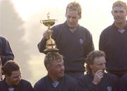15 September 2004; Ian Poulter, Team Europe 2004, puts the Ryder Cup on the head of team-mate Darren Clarke before the team picture is taken in advance of the 35th Ryder Cup Matches. Oakland Hills Country Club, Bloomfield Township, Michigan, USA. Picture credit; Matt Browne / SPORTSFILE