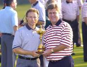 15 September 2004; European captain Bernhard Langer and US captain Hal Sutton with the Ryder cup at the 35th Ryder Cup. Oakland Hills Country Club, Bloomfield Township, Michigan, USA. Picture credit; Matt Browne / SPORTSFILE
