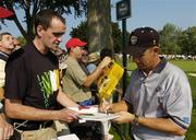 15 September 2004; Padraig Harrington, Team Europe 2004, signs the autograph book of Brian Downey, Cork, during the practice round in advance of the 35th Ryder Cup Matches. Oakland Hills Country Club, Bloomfield Township, Michigan, USA. Picture credit; Matt Browne / SPORTSFILE