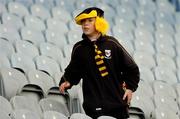 12 September 2004; A young Kilkenny fan makes his way to his seat before the game. All-Ireland Minor Hurling Championship Final, Galway v Kilkenny, Croke Park, Dublin. Picture credit; Brian Lawless / SPORTSFILE *** Local Caption *** Any photograph taken by SPORTSFILE during, or in connection with, the 2004 Guinness All-Ireland Hurling Final which displays GAA logos or contains an image or part of an image of any GAA intellectual property, or, which contains images of a GAA player/players in their playing uniforms, may only be used for editorial and non-advertising purposes.  Use of photographs for advertising, as posters or for purchase separately is strictly prohibited unless prior written approval has been obtained from the Gaelic Athletic Association.