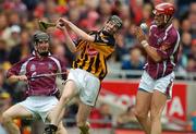 12 September 2004; Gavin Nolan, Kilkenny, in action against Paul Madden, left, and John Lee, Galway. All-Ireland Minor Hurling Championship Final, Galway v Kilkenny, Croke Park, Dublin. Picture credit; Brendan Moran / SPORTSFILE *** Local Caption *** Any photograph taken by SPORTSFILE during, or in connection with, the 2004 Guinness All-Ireland Hurling Final which displays GAA logos or contains an image or part of an image of any GAA intellectual property, or, which contains images of a GAA player/players in their playing uniforms, may only be used for editorial and non-advertising purposes.  Use of photographs for advertising, as posters or for purchase separately is strictly prohibited unless prior written approval has been obtained from the Gaelic Athletic Association.