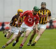 12 September 2004; Jerry O'Connor, Cork, in action against Ken Coogan, right, and James 'Cha' Fitzpatrick, Kilkenny. Guinness All-Ireland Senior Hurling Championship Final, Cork v Kilkenny, Croke Park, Dublin. Picture credit; Damien Eagers / SPORTSFILE *** Local Caption *** Any photograph taken by SPORTSFILE during, or in connection with, the 2004 Guinness All-Ireland Hurling Final which displays GAA logos or contains an image or part of an image of any GAA intellectual property, or, which contains images of a GAA player/players in their playing uniforms, may only be used for editorial and non-advertising purposes.  Use of photographs for advertising, as posters or for purchase separately is strictly prohibited unless prior written approval has been obtained from the Gaelic Athletic Association.