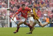 12 September 2004; Sean Og O'hAilpin, Cork, in action against John Hoyne, Kilkenny. Guinness All-Ireland Senior Hurling Championship Final, Cork v Kilkenny, Croke Park, Dublin. Picture credit; Damien Eagers / SPORTSFILE *** Local Caption *** Any photograph taken by SPORTSFILE during, or in connection with, the 2004 Guinness All-Ireland Hurling Final which displays GAA logos or contains an image or part of an image of any GAA intellectual property, or, which contains images of a GAA player/players in their playing uniforms, may only be used for editorial and non-advertising purposes.  Use of photographs for advertising, as posters or for purchase separately is strictly prohibited unless prior written approval has been obtained from the Gaelic Athletic Association.