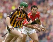 12 September 2004; Henry Shefflin, Kilkenny, in action against Sean Og O'hAilpin, Cork. Guinness All-Ireland Senior Hurling Championship Final, Cork v Kilkenny, Croke Park, Dublin. Picture credit; Damien Eagers / SPORTSFILE *** Local Caption *** Any photograph taken by SPORTSFILE during, or in connection with, the 2004 Guinness All-Ireland Hurling Final which displays GAA logos or contains an image or part of an image of any GAA intellectual property, or, which contains images of a GAA player/players in their playing uniforms, may only be used for editorial and non-advertising purposes.  Use of photographs for advertising, as posters or for purchase separately is strictly prohibited unless prior written approval has been obtained from the Gaelic Athletic Association.