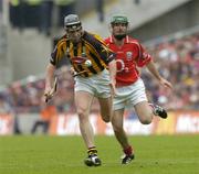 12 September 2004; Derek Lyng, Kilkenny, in action against Jerry O'Connor, Cork. Guinness All-Ireland Senior Hurling Championship Final, Cork v Kilkenny, Croke Park, Dublin. Picture credit; Damien Eagers / SPORTSFILE *** Local Caption *** Any photograph taken by SPORTSFILE during, or in connection with, the 2004 Guinness All-Ireland Hurling Final which displays GAA logos or contains an image or part of an image of any GAA intellectual property, or, which contains images of a GAA player/players in their playing uniforms, may only be used for editorial and non-advertising purposes.  Use of photographs for advertising, as posters or for purchase separately is strictly prohibited unless prior written approval has been obtained from the Gaelic Athletic Association.