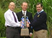 16 September 2004; Kilkenny U21 manager Martin Fogarty, left, and Seamus Power, Tipperary Under 21 manager, right, with Paddy Bourke, Erin National Sales Manager hold the Cross of Cashel trophy ahead of the Erin U21 All-Ireland Hurling Final which will take place in Nowlan Park, Co. Kilkenny, on Saturday next. Merrion Hotel, Dublin. Picture credit; Pat Murphy / SPORTSFILE