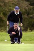 16 September 2004; Mark Collins and Seamus McMonagle, wearing cap, Sutton Golf Club, lines up a putt on the 8th hole. Bulmers Barton Shield Final, Ballyclare Golf Club v Sutton Golf Club, Shannon Golf Club, Shannon, Co. Clare. Picture credit; Ray McManus / SPORTSFILE