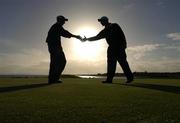 16 September 2004; Sutton Golf Club players Derek Downie and Alan Darbey reach out to congratulate each other on winning the Bulmers Barton Shield Final, Ballyclare Golf Club v Sutton Golf Club, Shannon Golf Club, Shannon, Co. Clare. Picture credit; Ray McManus / SPORTSFILE