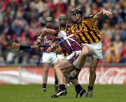 12 September 2004; Andrew Karey, Galway, in action against Patrick Hogan, Kilkenny. All-Ireland Minor Hurling Championship Final, Galway v Kilkenny, Croke Park, Dublin. Picture credit; Brendan Moran / SPORTSFILE *** Local Caption *** Any photograph taken by SPORTSFILE during, or in connection with, the 2004 Guinness All-Ireland Hurling Final which displays GAA logos or contains an image or part of an image of any GAA intellectual property, or, which contains images of a GAA player/players in their playing uniforms, may only be used for editorial and non-advertising purposes.  Use of photographs for advertising, as posters or for purchase separately is strictly prohibited unless prior written approval has been obtained from the Gaelic Athletic Association.