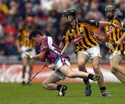 12 September 2004; Andrew Karey, Galway, in action against Patrick Hogan, Kilkenny. All-Ireland Minor Hurling Championship Final, Galway v Kilkenny, Croke Park, Dublin. Picture credit; Brendan Moran / SPORTSFILE *** Local Caption *** Any photograph taken by SPORTSFILE during, or in connection with, the 2004 Guinness All-Ireland Hurling Final which displays GAA logos or contains an image or part of an image of any GAA intellectual property, or, which contains images of a GAA player/players in their playing uniforms, may only be used for editorial and non-advertising purposes.  Use of photographs for advertising, as posters or for purchase separately is strictly prohibited unless prior written approval has been obtained from the Gaelic Athletic Association.