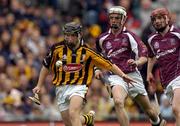 12 September 2004; Richard Hogan, Kilkenny, in action against John Hughes, and Ciaran O'Donovan, right, Galway. All-Ireland Minor Hurling Championship Final, Galway v Kilkenny, Croke Park, Dublin. Picture credit; Brendan Moran / SPORTSFILE *** Local Caption *** Any photograph taken by SPORTSFILE during, or in connection with, the 2004 Guinness All-Ireland Hurling Final which displays GAA logos or contains an image or part of an image of any GAA intellectual property, or, which contains images of a GAA player/players in their playing uniforms, may only be used for editorial and non-advertising purposes.  Use of photographs for advertising, as posters or for purchase separately is strictly prohibited unless prior written approval has been obtained from the Gaelic Athletic Association.