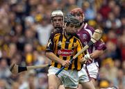 12 September 2004; Richard Hogan, Kilkenny, in action against John Hughes, left, and Ciaran O'Donovan, Galway. All-Ireland Minor Hurling Championship Final, Galway v Kilkenny, Croke Park, Dublin. Picture credit; Brendan Moran / SPORTSFILE *** Local Caption *** Any photograph taken by SPORTSFILE during, or in connection with, the 2004 Guinness All-Ireland Hurling Final which displays GAA logos or contains an image or part of an image of any GAA intellectual property, or, which contains images of a GAA player/players in their playing uniforms, may only be used for editorial and non-advertising purposes.  Use of photographs for advertising, as posters or for purchase separately is strictly prohibited unless prior written approval has been obtained from the Gaelic Athletic Association.