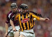12 September 2004; Gavin Nolan, Kilkenny, in action against Gerard Mahon, Galway. All-Ireland Minor Hurling Championship Final, Galway v Kilkenny, Croke Park, Dublin. Picture credit; Brendan Moran / SPORTSFILE *** Local Caption *** Any photograph taken by SPORTSFILE during, or in connection with, the 2004 Guinness All-Ireland Hurling Final which displays GAA logos or contains an image or part of an image of any GAA intellectual property, or, which contains images of a GAA player/players in their playing uniforms, may only be used for editorial and non-advertising purposes.  Use of photographs for advertising, as posters or for purchase separately is strictly prohibited unless prior written approval has been obtained from the Gaelic Athletic Association.