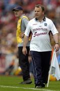 12 September 2004; Mattie Murphy, Galway manager, walks the sideline alongside Kilkenny manager Br. Damien Brennan. All-Ireland Minor Hurling Championship Final, Galway v Kilkenny, Croke Park, Dublin. Picture credit; Brendan Moran / SPORTSFILE *** Local Caption *** Any photograph taken by SPORTSFILE during, or in connection with, the 2004 Guinness All-Ireland Hurling Final which displays GAA logos or contains an image or part of an image of any GAA intellectual property, or, which contains images of a GAA player/players in their playing uniforms, may only be used for editorial and non-advertising purposes.  Use of photographs for advertising, as posters or for purchase separately is strictly prohibited unless prior written approval has been obtained from the Gaelic Athletic Association.