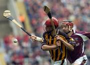 12 September 2004; James Maher, Kilkenny, in action against Galway. All-Ireland Minor Hurling Championship Final, Galway v Kilkenny, Croke Park, Dublin. Picture credit; Damien Eagers / SPORTSFILE *** Local Caption *** Any photograph taken by SPORTSFILE during, or in connection with, the 2004 Guinness All-Ireland Hurling Final which displays GAA logos or contains an image or part of an image of any GAA intellectual property, or, which contains images of a GAA player/players in their playing uniforms, may only be used for editorial and non-advertising purposes.  Use of photographs for advertising, as posters or for purchase separately is strictly prohibited unless prior written approval has been obtained from the Gaelic Athletic Association.